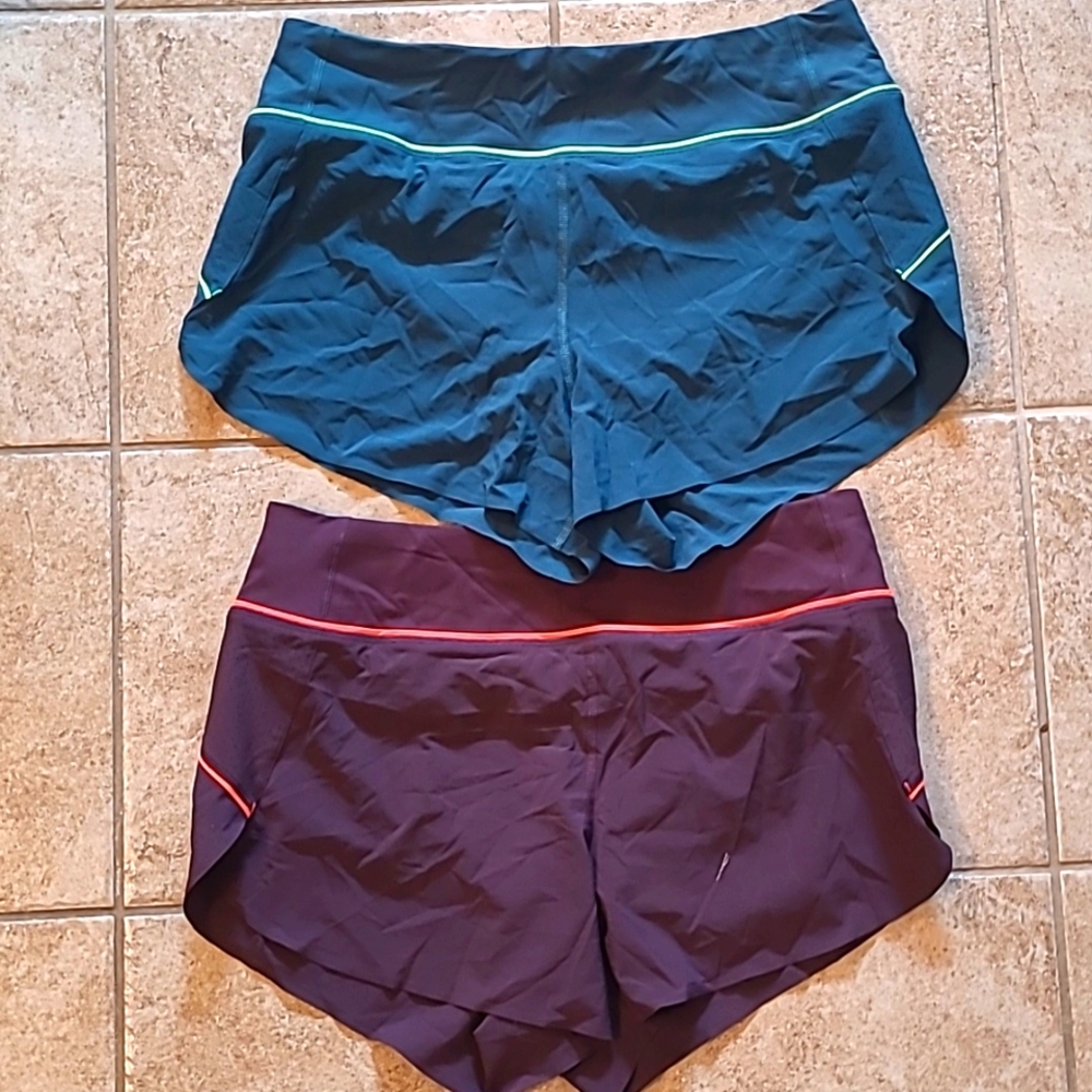 Two athleta run with it shorts